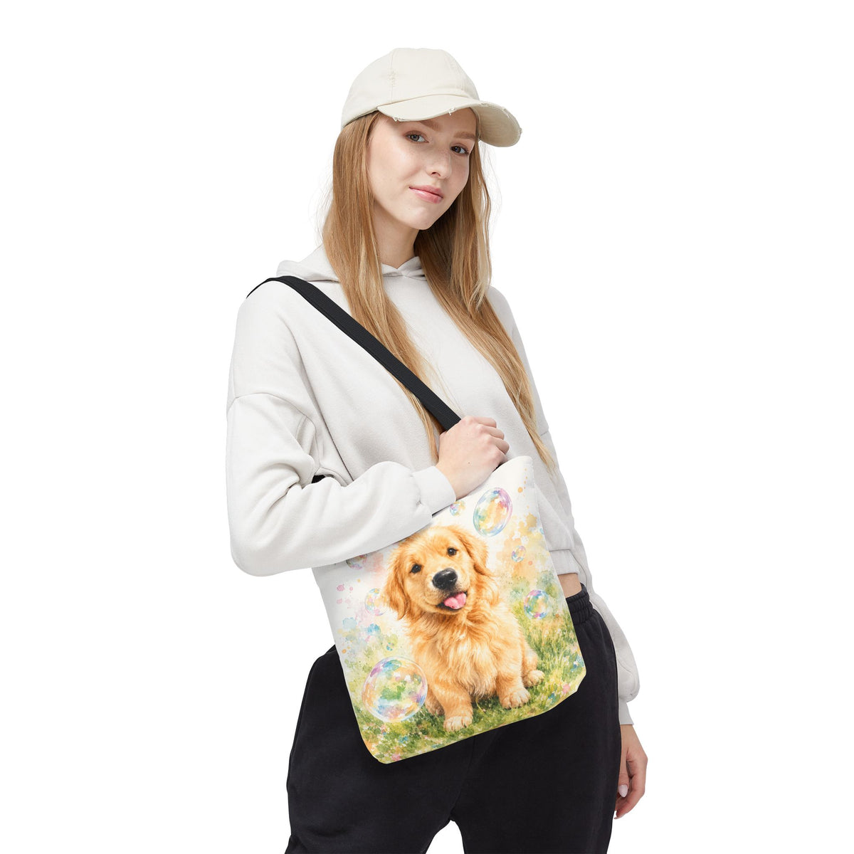 Tote bag printed with a Golden Retriever puppy in a meadow surrounded by pastel floating bubbles