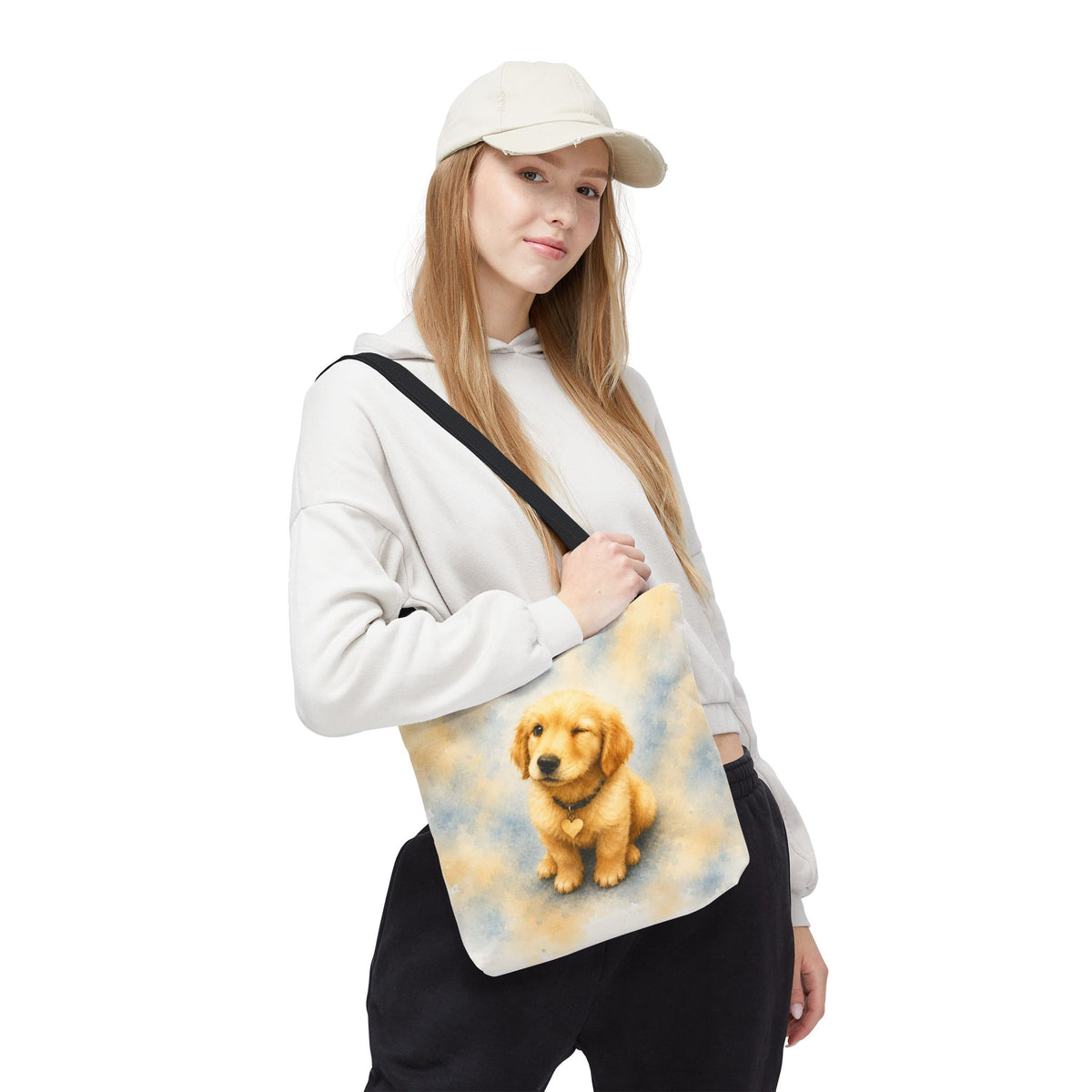 Tote bag printed with a winking Golden Retriever puppy in soft yellow and dusty blue watercolor
