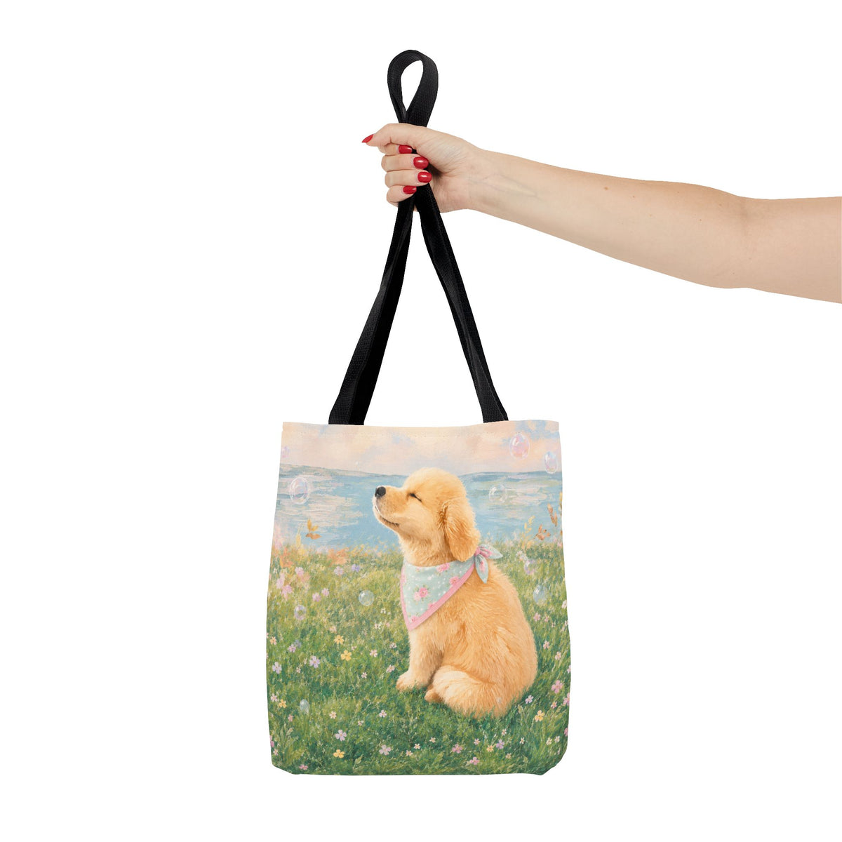 Tote bag printed with a Golden Retriever puppy in a wildflower meadow wearing a pastel bandana