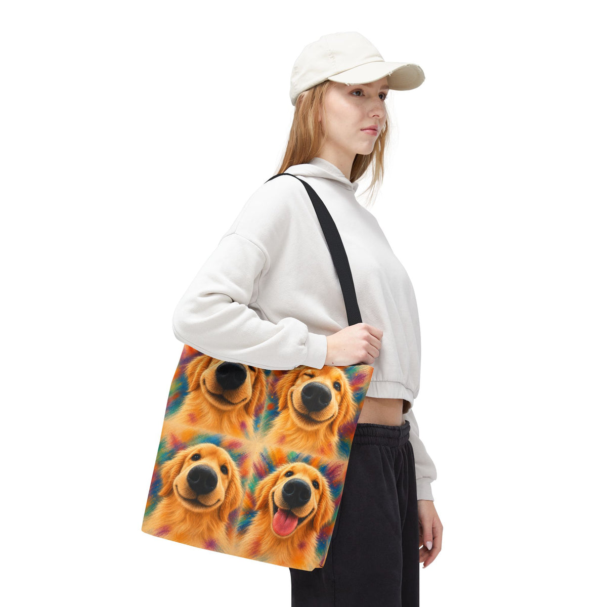 Tote bag printed with four Golden Retriever faces in bold orange, teal, and gold watercolor strokes