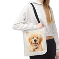 Tote bag printed with a Golden Retriever puppy wearing small white hair ribbons in warm watercolor