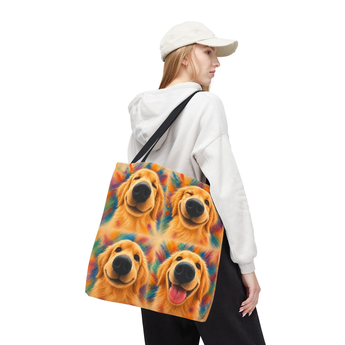 Tote bag printed with four Golden Retriever faces in bold orange, teal, and gold watercolor strokes