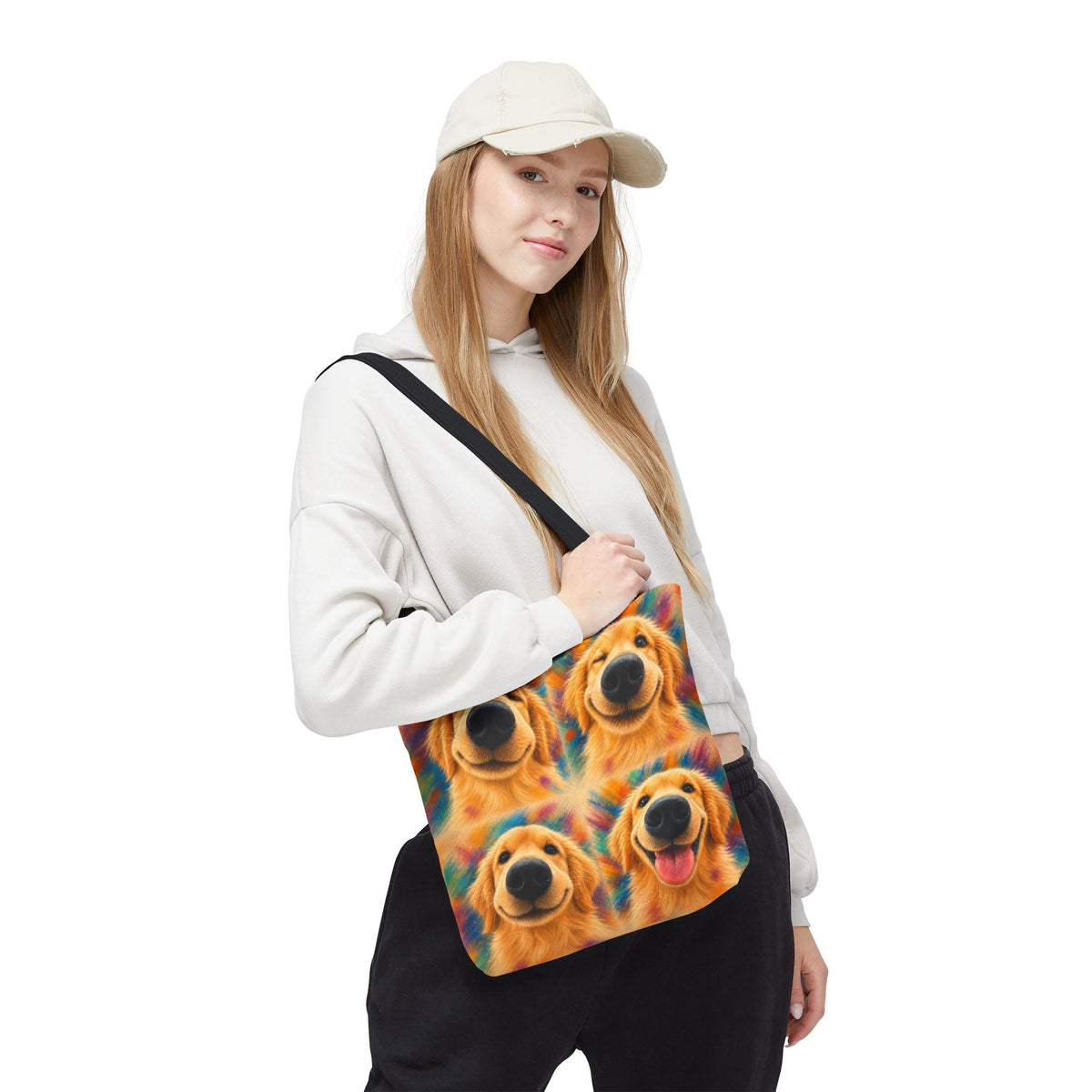 Tote bag printed with four Golden Retriever faces in bold orange, teal, and gold watercolor strokes